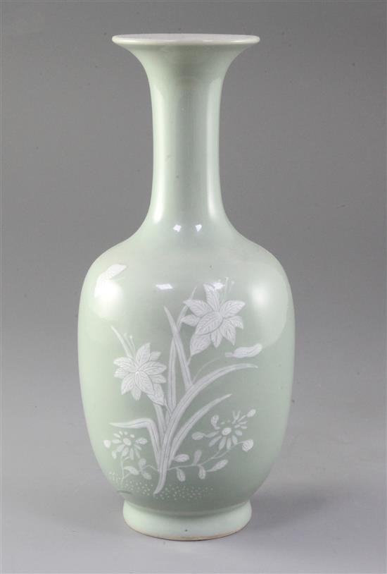 A Chinese celadon ground bottle vase, 19th century, height 26cm